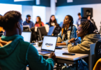 A vibrant digital classroom filled with diverse, enthusiastic musicians and indie artists attending a marketing workshop led by experts from Amazon Music and Symphonic, featuring laptops with the logo