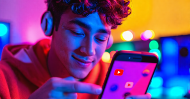 An enthusiastic young musician uploading a series of three engaging and colorful YouTube Shorts to a smartphone, each showcasing different genres, with vibrant visual effects that pop off the screen i